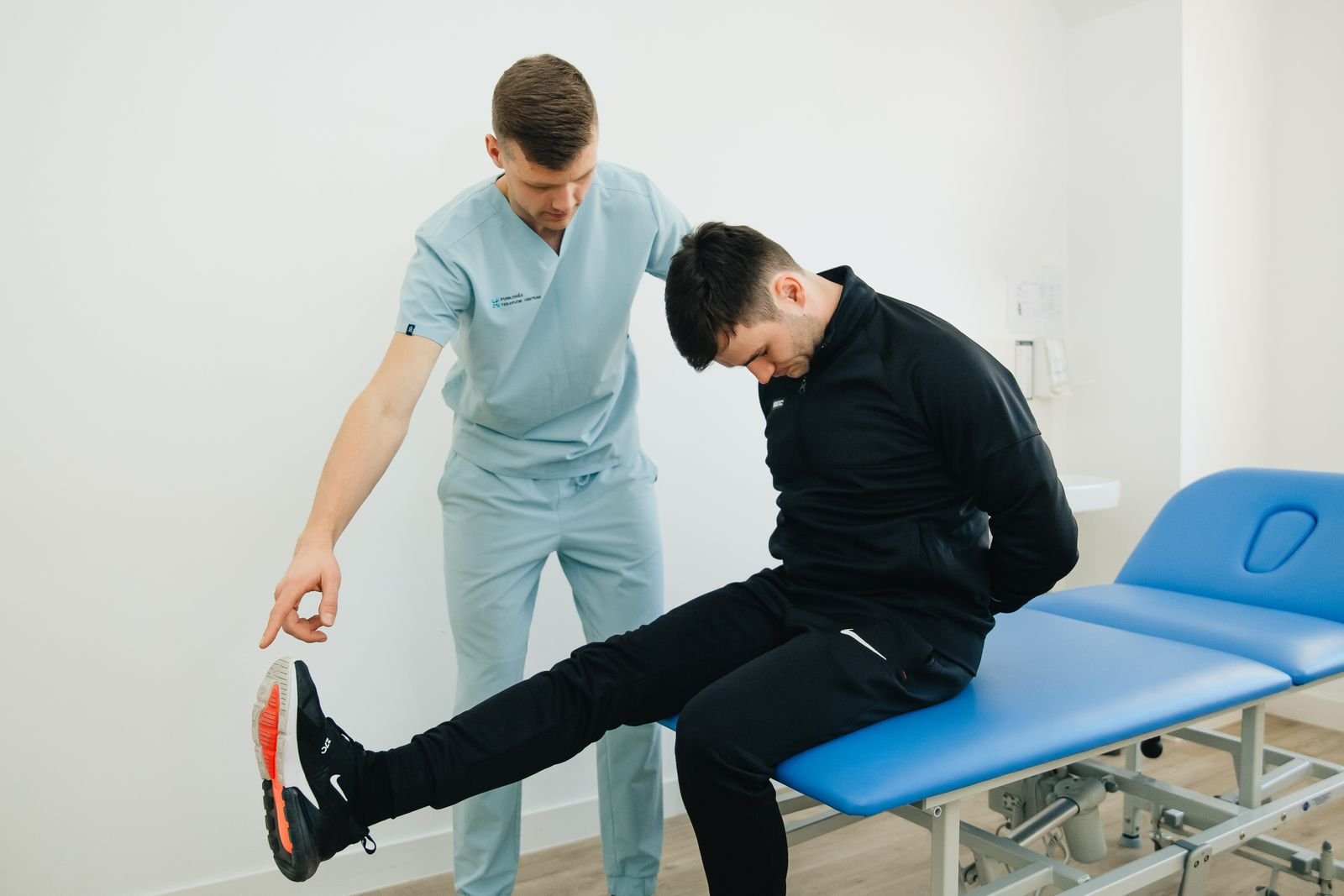 Physiotherapist guiding movement practice — illustrative stock photograph